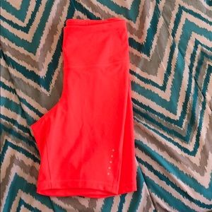 Neon orange compression bike shorts
